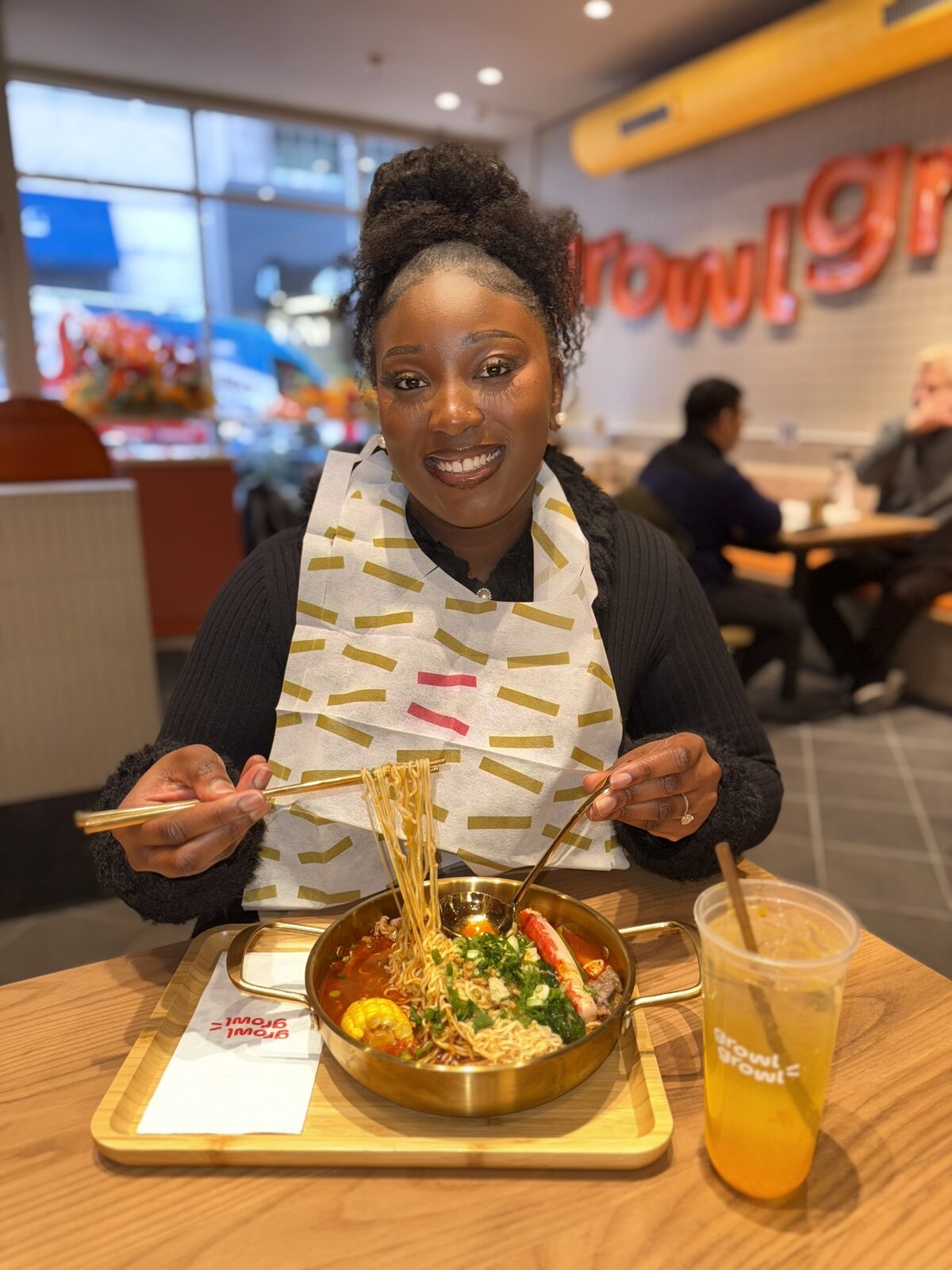 Fikayo lifting noodles from a hot pot at Growl restaurant